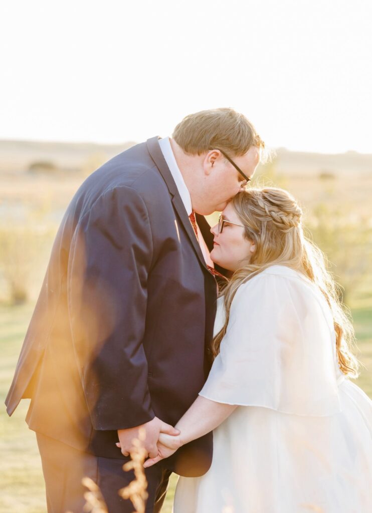 plus size organza ballgown wedding dress with sleeves chandler arizona bridal shop with plus size groom