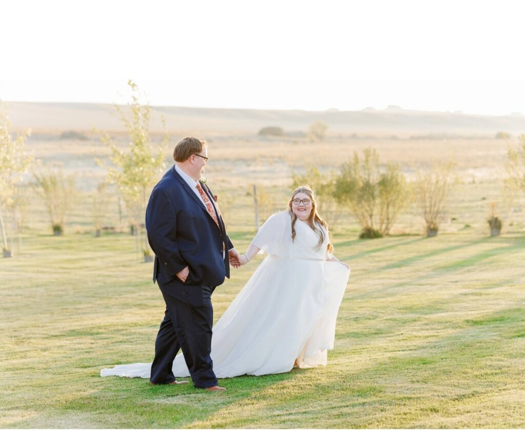 plus size organza ballgown wedding dress with sleeves chandler arizona bridal shop with plus size groom