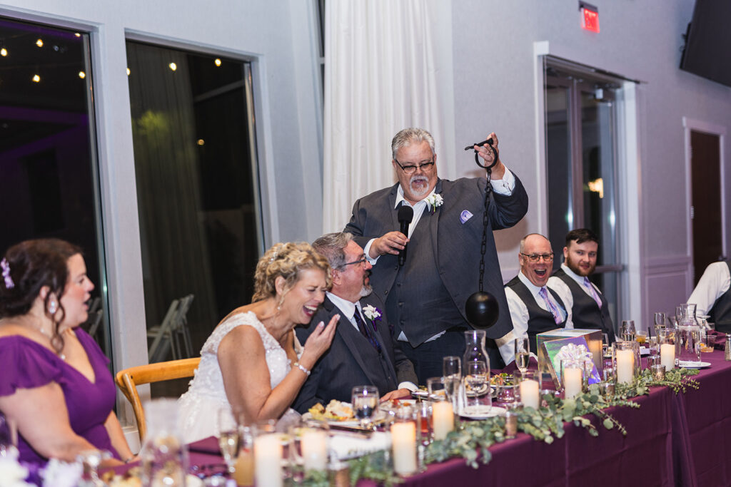 mature bride wearing neck traditional wedding dress at outdoor wedding in gilbert arizona from strut bridal salon laughing at humorous toast