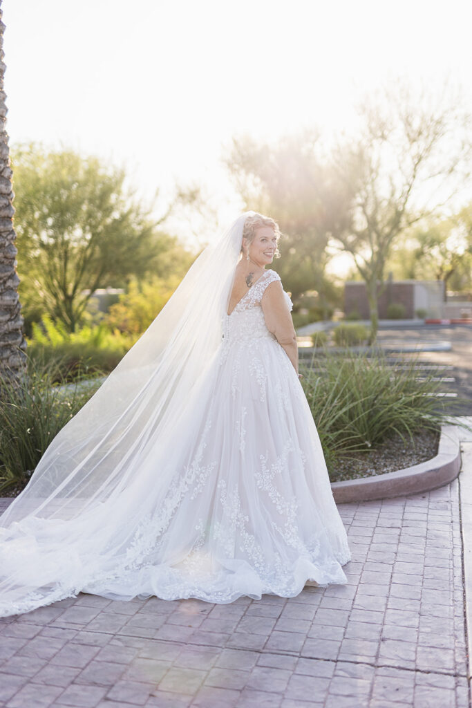 mature bride wearing neck traditional wedding dress at outdoor wedding in gilbert arizona from strut bridal salon