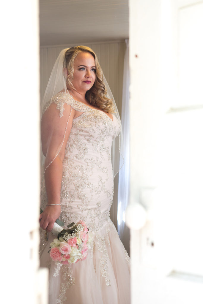 real plus size bride in beaded champagne wedding dress Los Angeles