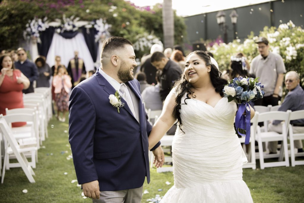 newlyweds after ceremony plus size mermaid wedding dress