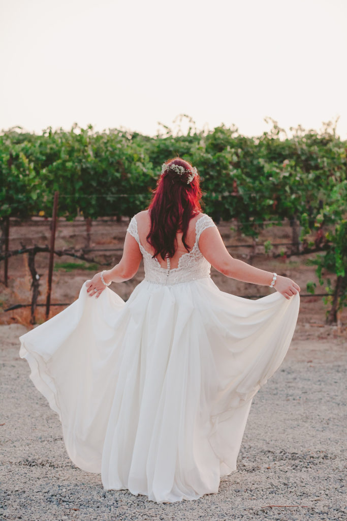 illusion back plus size wedding dress with straps and chiffon skirt from Long Beach bridal store