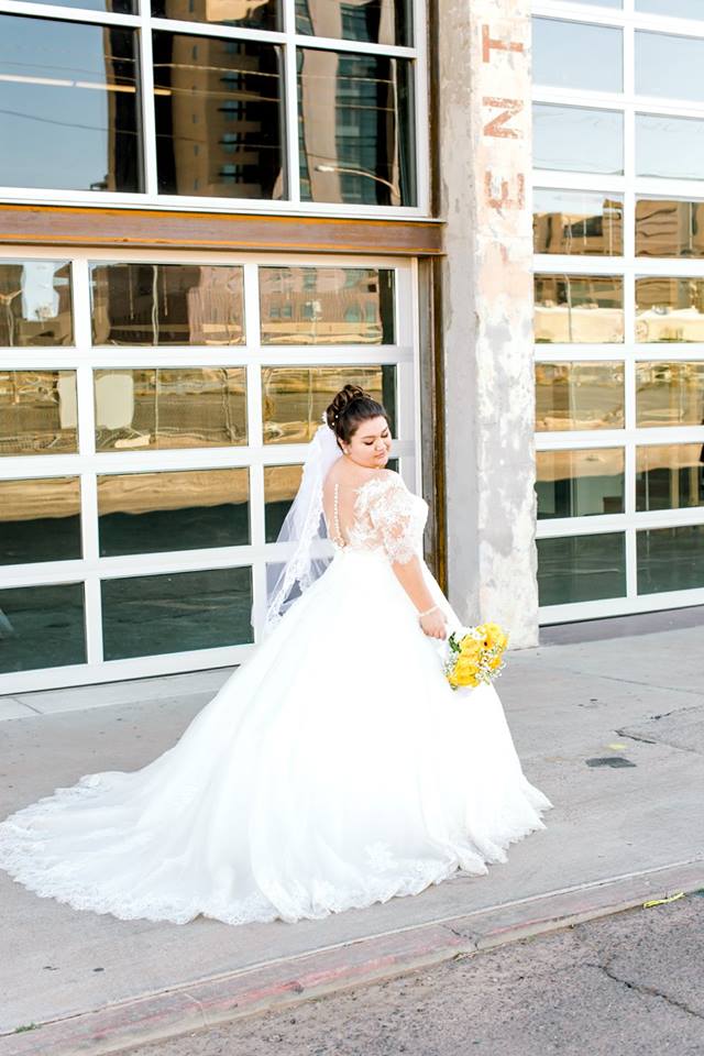 curvy bride in illusion back plus size ballgown wedding dress