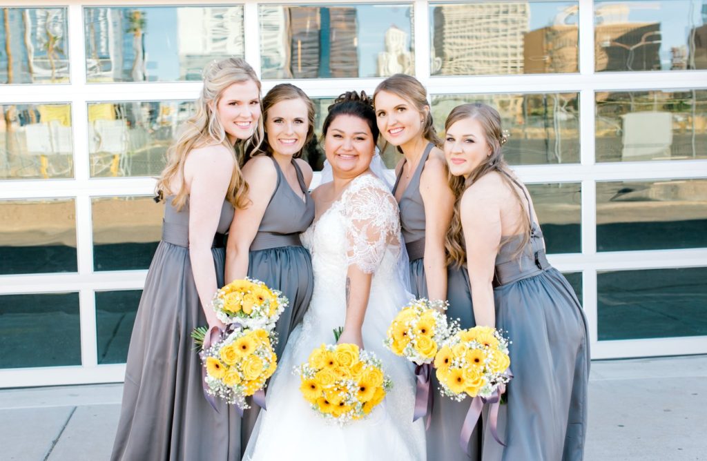 curvy bride and bridesmaids wearing gray