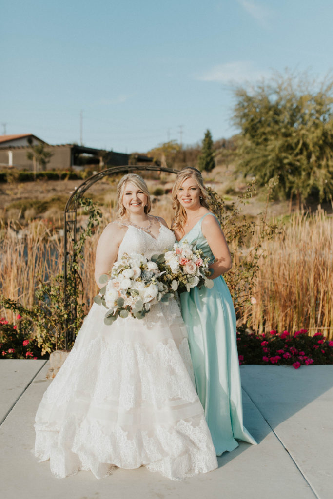real plus size bride and bridesmaid in satin dress