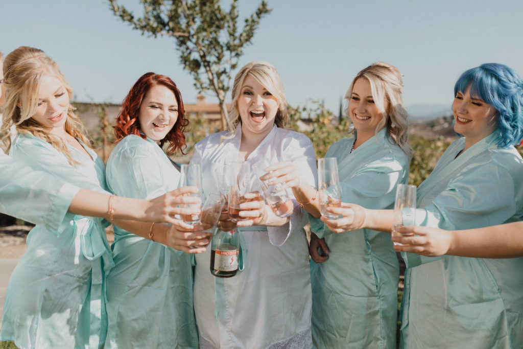 bride and bridesmaid in robes