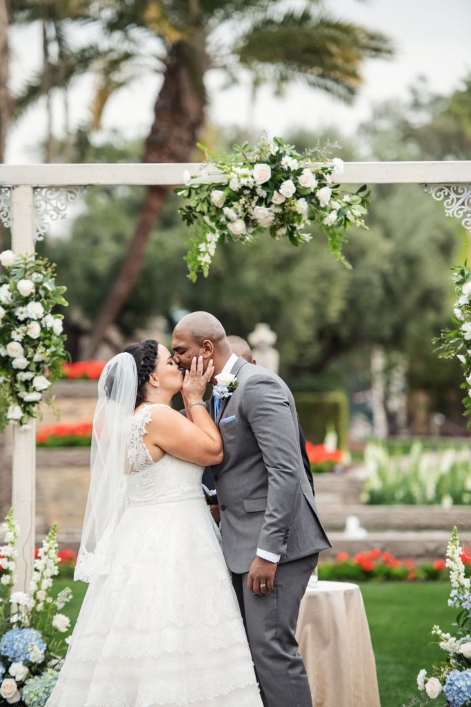 plus size bride first kiss as husband and wife