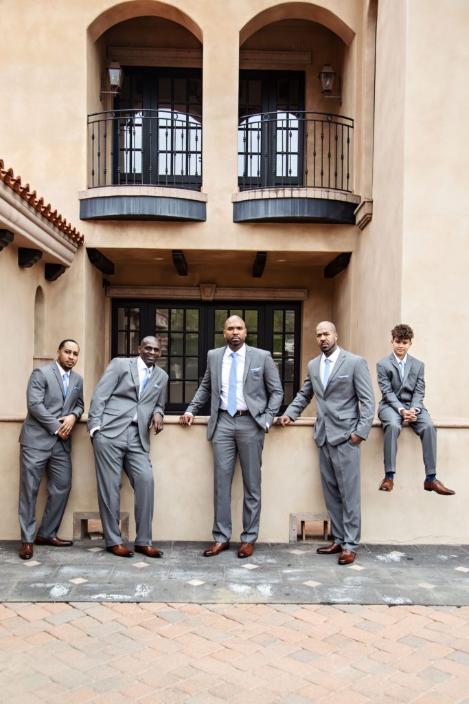 groomsmen in gray suits with blue ties