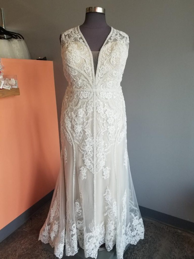 Slim sheath with wide straps and beaded and lace design on a plus size wedding dress