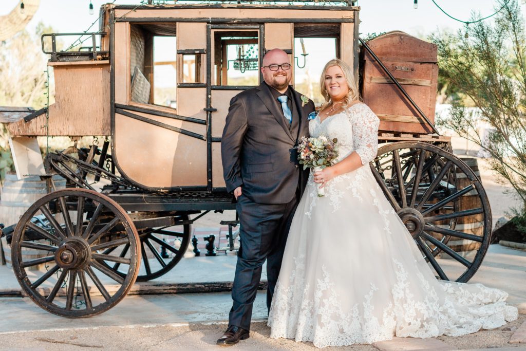 couple in front of stagecoach