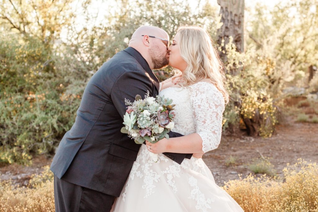 plus size bride wearing long sleeve wedding dress