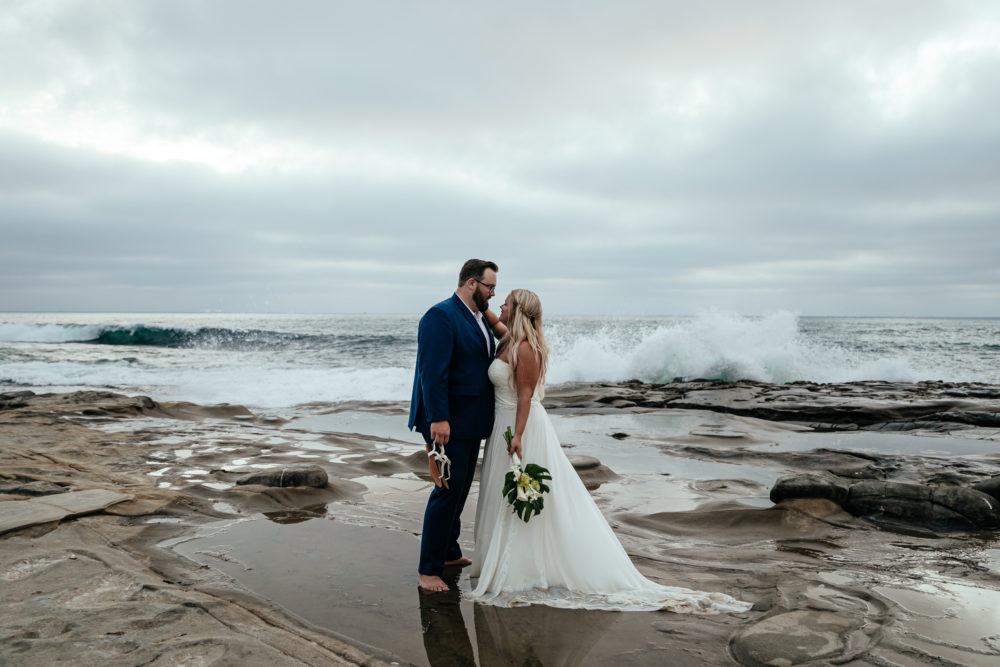 couple-on-beach-wearing-chiffon-bottom-beach-wedding-dress-california