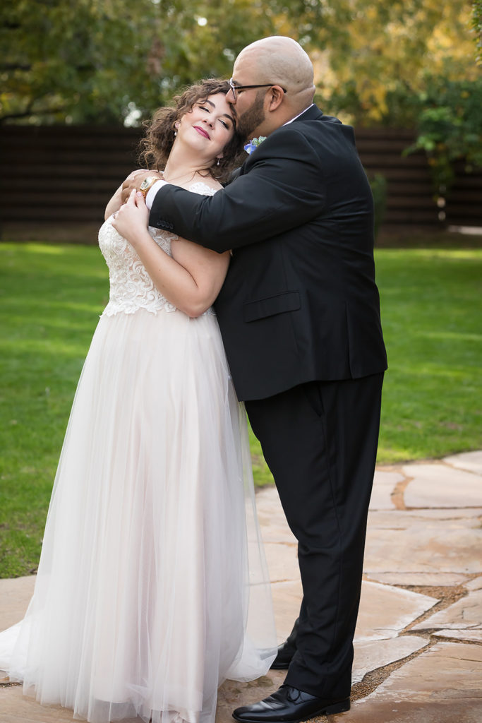 bride-wearing-tulle-aline-wedding-dress-and-groom-in-tux