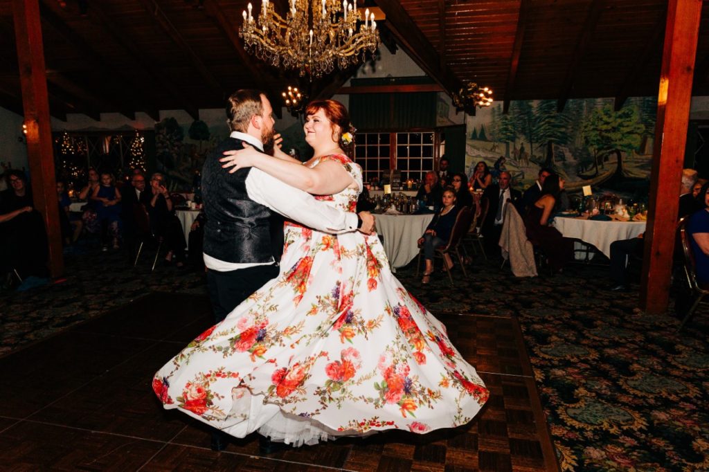 plus-size-bride-twirling-in-floral-chiffon-wedding-dress
