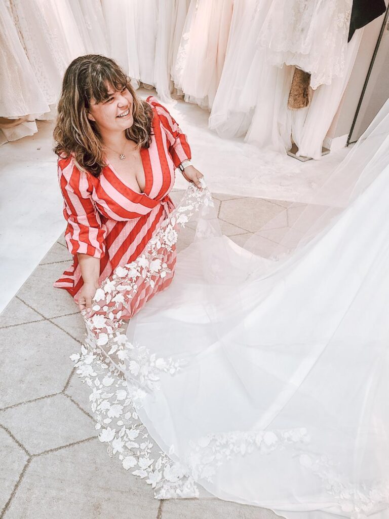 woman holding long wedding dress veil chandler arizona