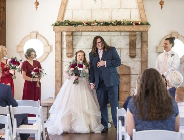 bride and groom in rustic indoor setting