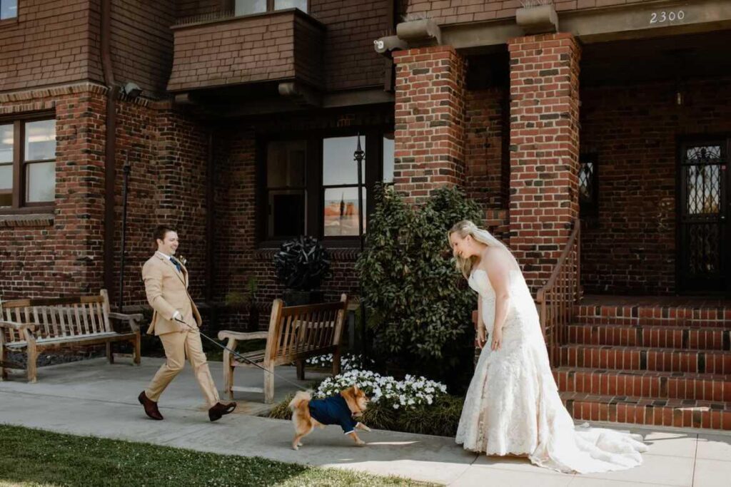 bride wearing two tone champagne lace mermaid wedding dress and groom in tan suit