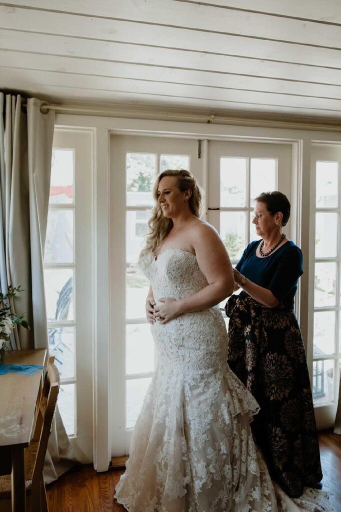 bride getting dressed for wedding ceremony long beach california