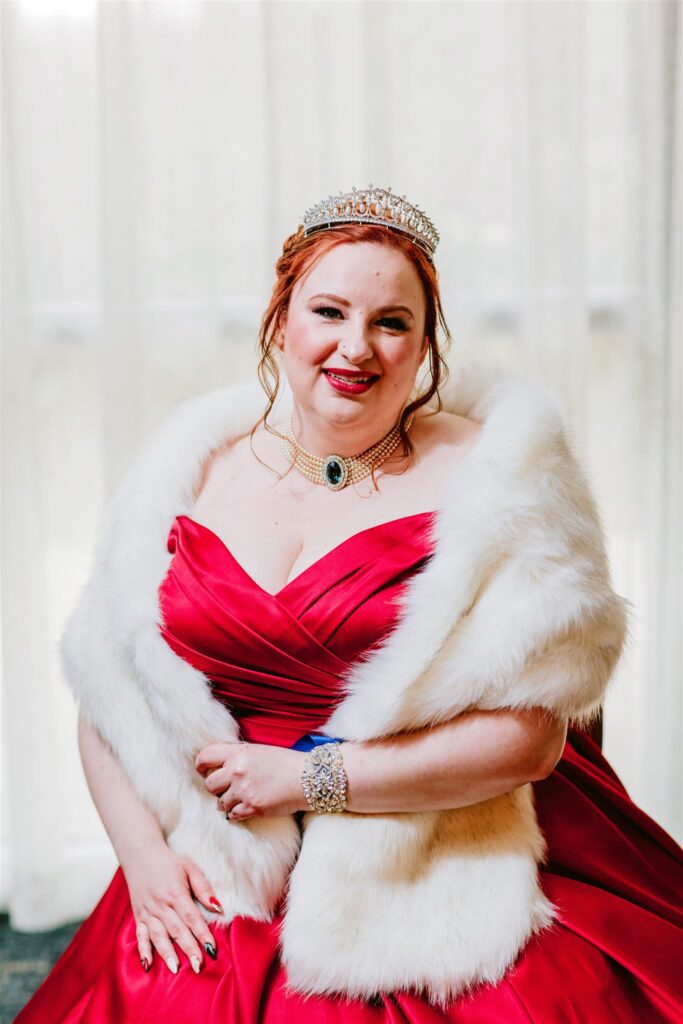 bride in red wedding dress with white fur wrap