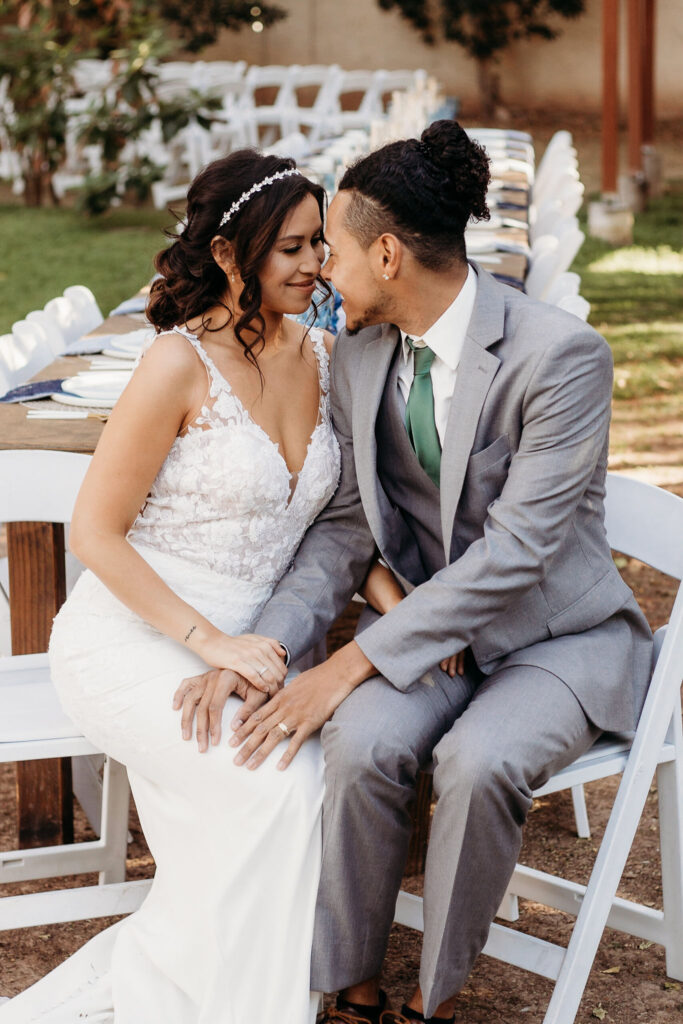 bride and groom sitting at table