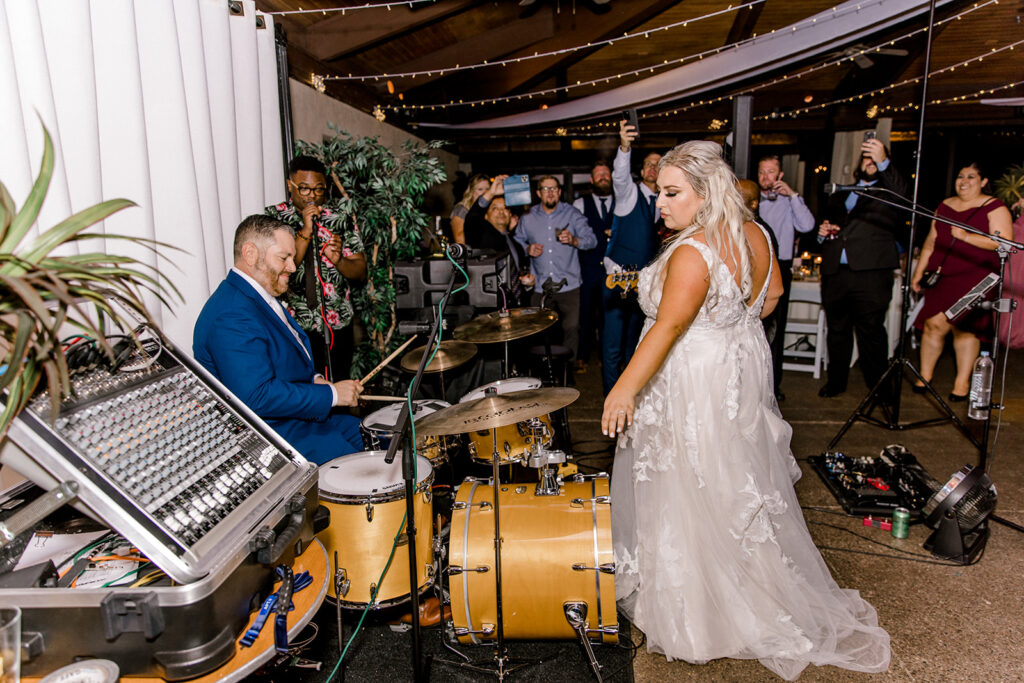 bride and groom with wedding band