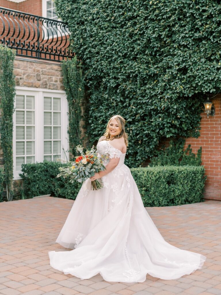 bride wearing off the shoulder wedding dress