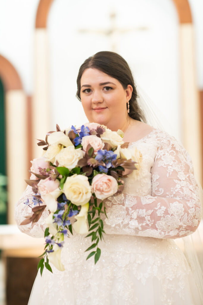 bride holding floral bouquet
