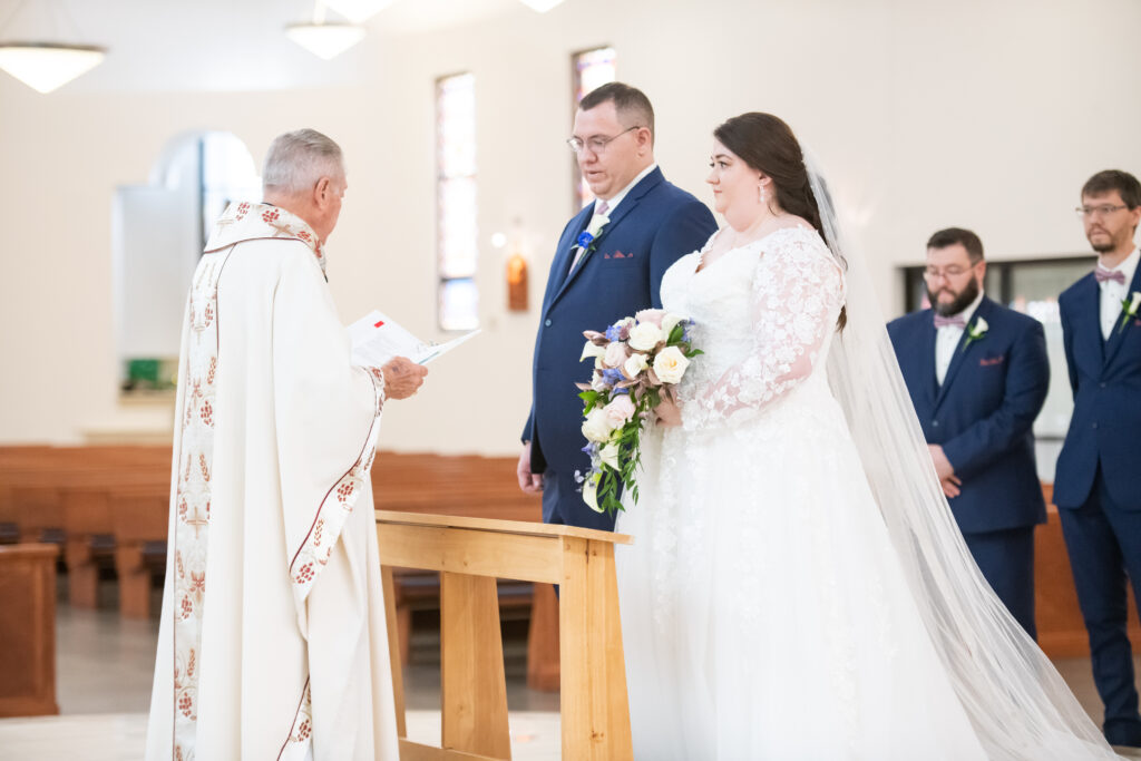 bride and groom at catholic wedding