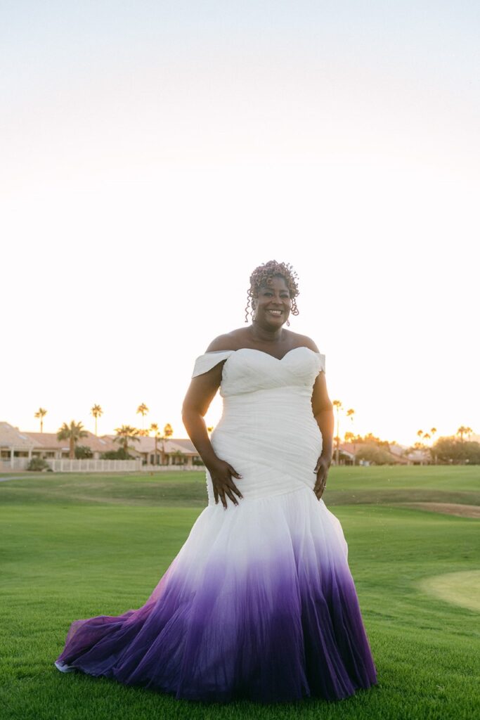 plus size bride wearing white and purple dip dyed wedding dress on golf course