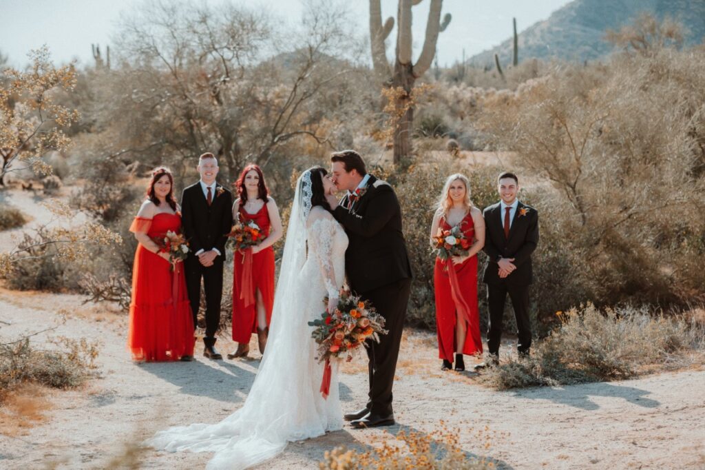 bride and groom with bridal party in arizona desert