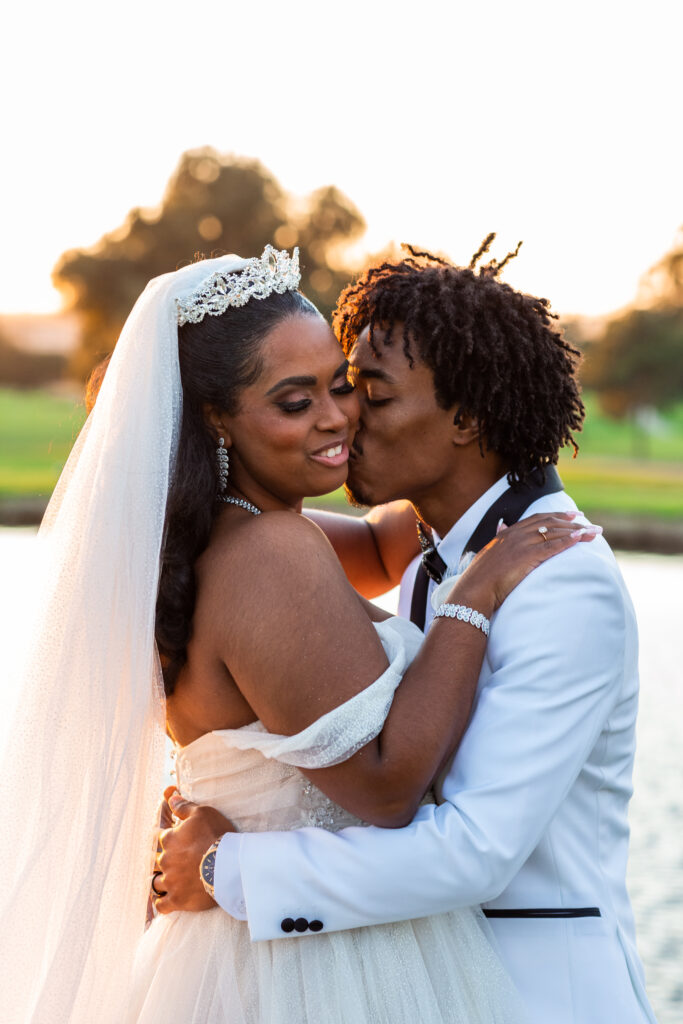 black bride and groom kissing