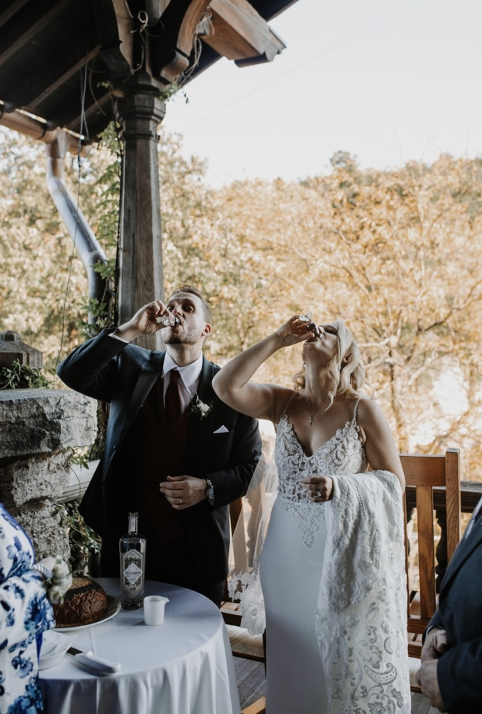 bride and groom taking shots