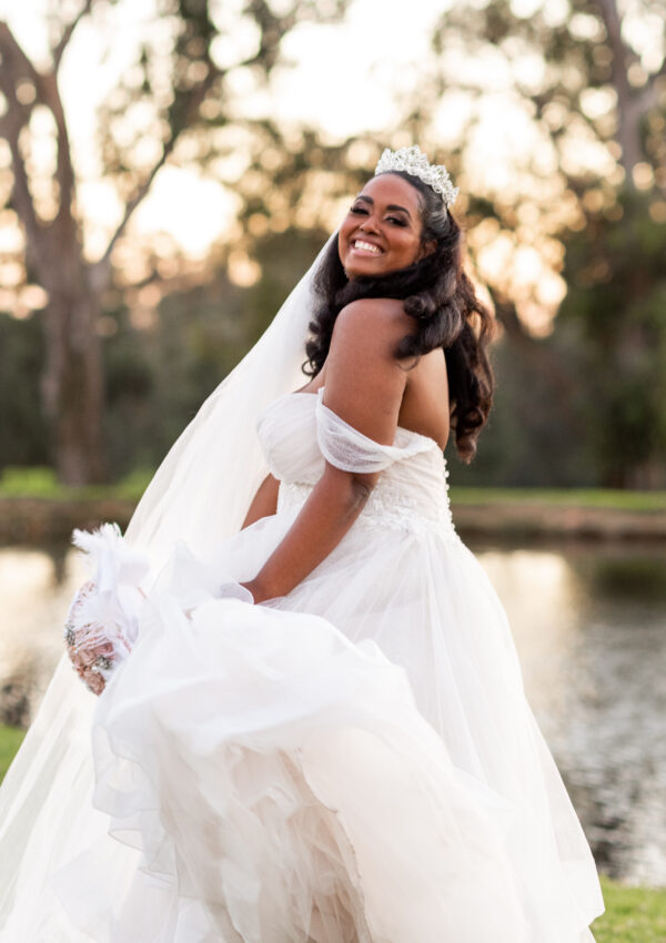 curvy bride smiling in wedding dress