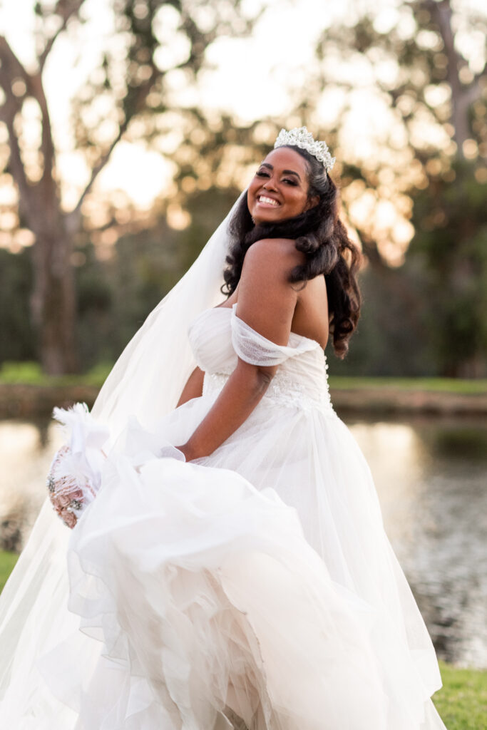 curvy bride smiling in wedding dress