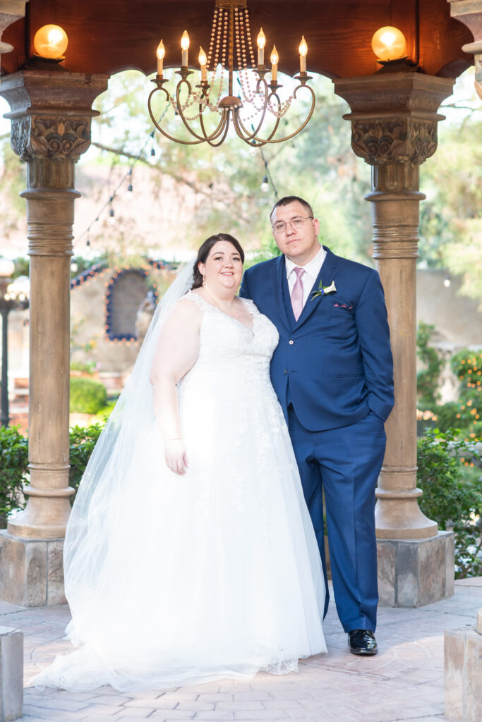 bride in ballgown wedding dress with groom in navy suit