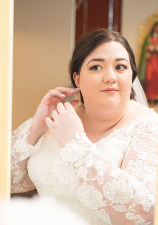 plus size bride wearing long sleeve lace wedding dress arizona