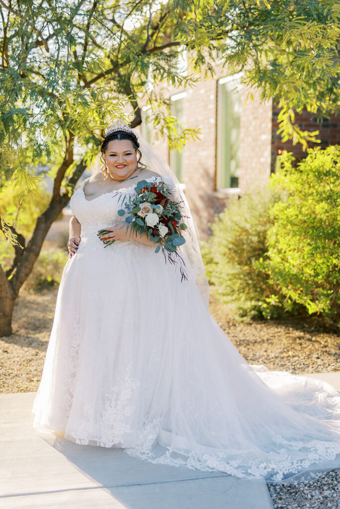 bride wearing off the shulder lace ballgown wedding dress