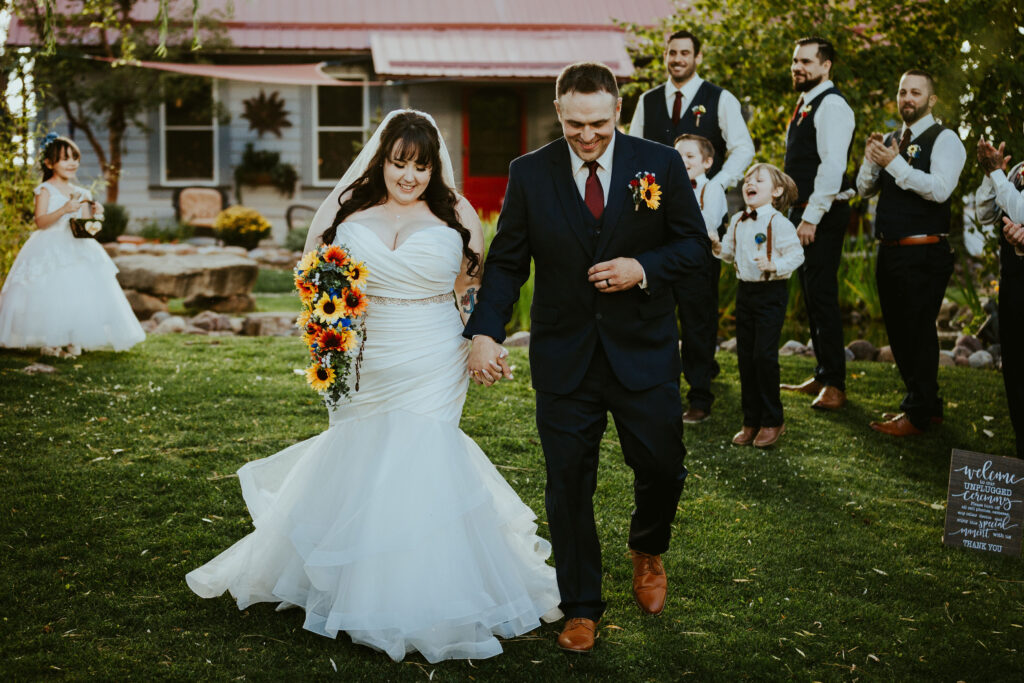 bride and groom walking down aisle