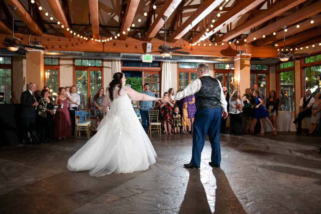 plus size bride and groom dancing at reception