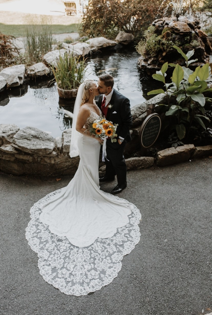 sexy crepe wedding dress with lace cutout train by waterfall New York