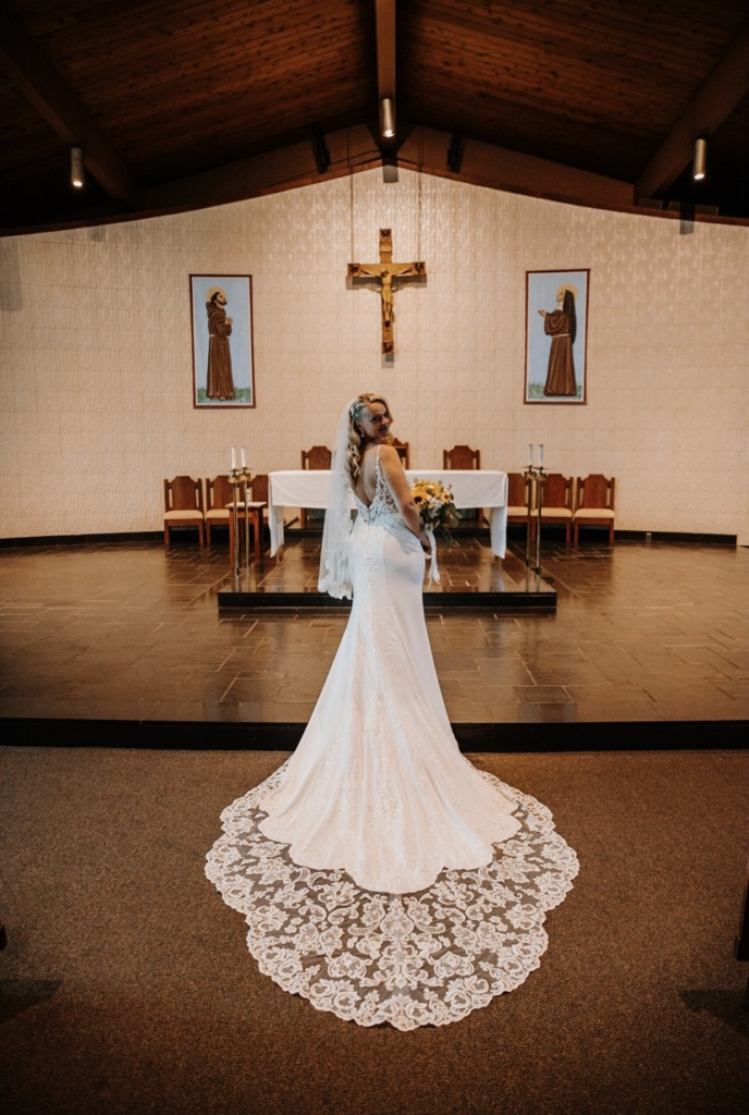 sexy crepe wedding dress with lace cutout train in church