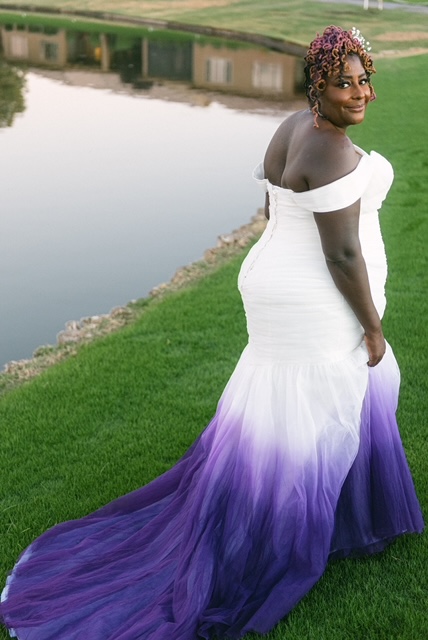 plus size bride wearing white and purple dip dyed wedding dress on golf course