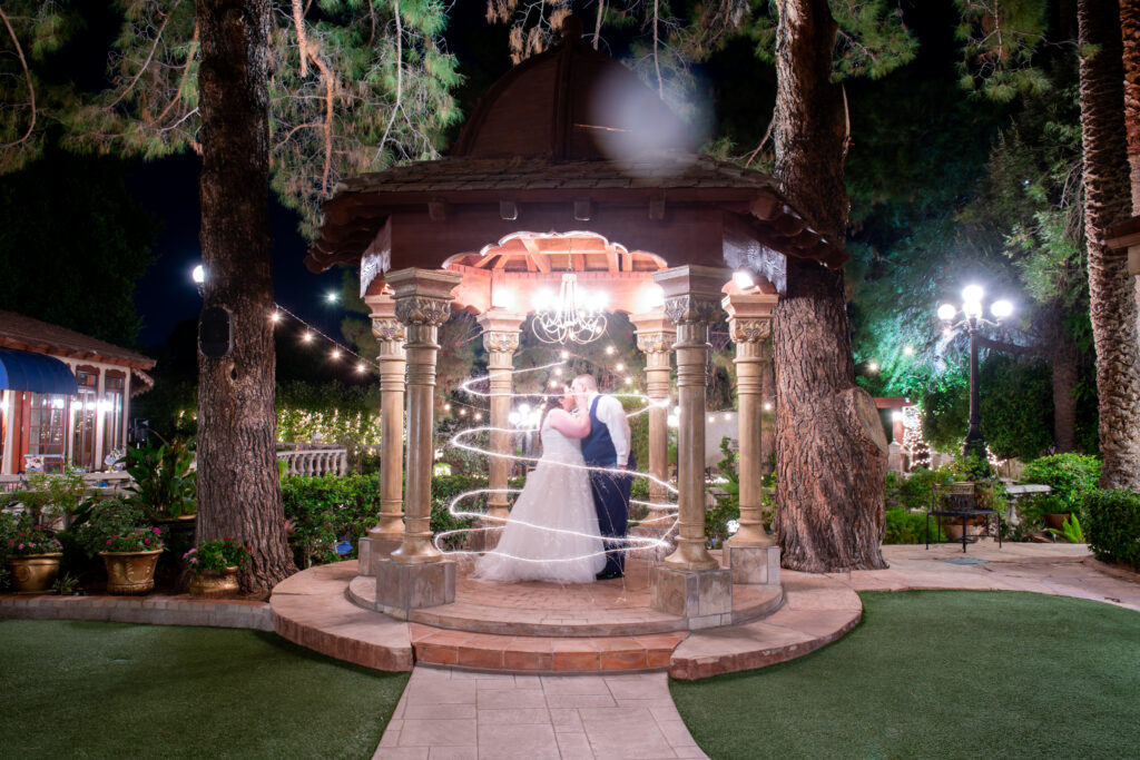 bride and groom with sparkles in gazebo chandler arizona