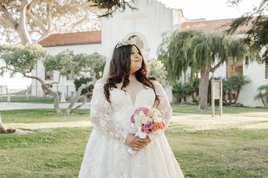 plus size bride wearing long sleeve wedding dress