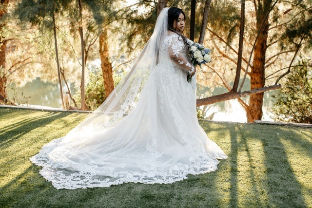 plus size bride in long sleeve ballgown wedding dress phoenix arizona
