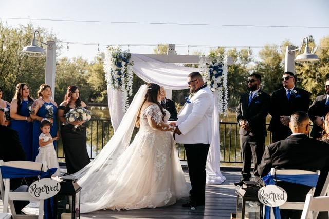 real plus size bride and groom on deck overlooking lake florence arizona