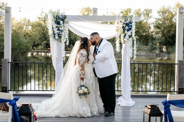 real plus size bride and groom on deck overlooking lake florence arizona