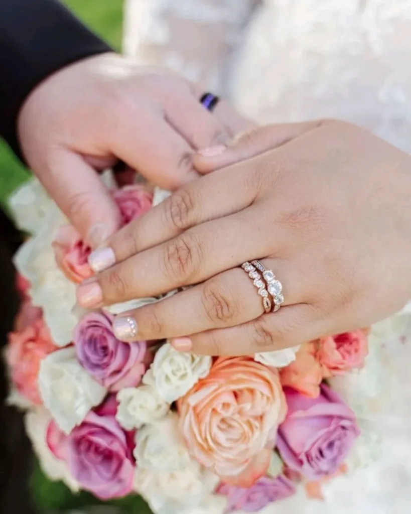 bride and groom ring photo on wedding bouquet