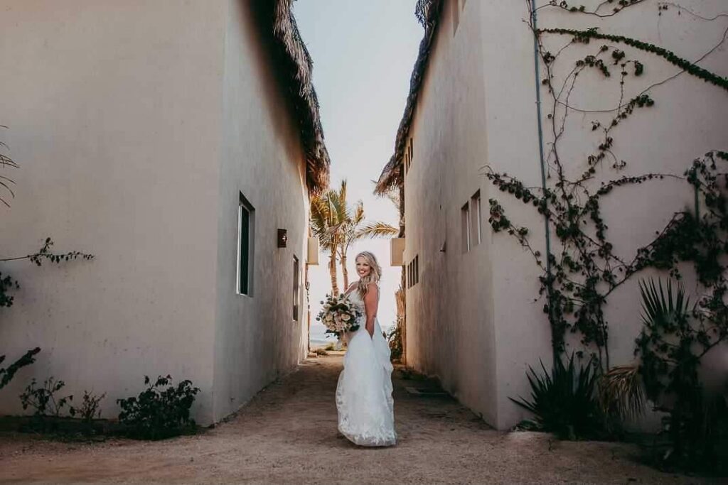 bride wearing sexy beach wedding dress in crepe